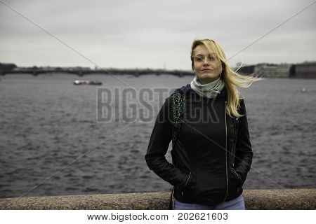 Beautiful Young Girl Looking At The Camera. The Wind Blows Into Her Hair