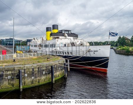 GLASGOW, SCOTLAND - JULY 22: The TS Queen Mary on the River Clyde on July 22, 2017 in Glasgow Scotland. It is a retired Clyde steamer launched in 1933 and is now being preserved as a museum ship.