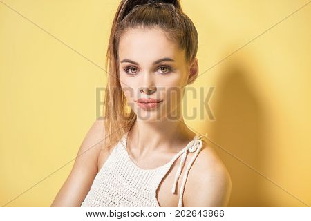 Portrait Of Young Brunette Woman With Brown Eyes.