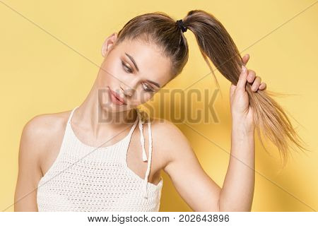 Portrait Of Young Brunette Woman With Brown Eyes.