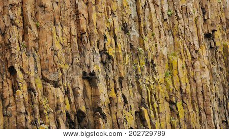 Section of basalt volcanic cliffs of Sugandisey Island, Stykkisholmur, Snaefellsnes peninsula, Iceland
