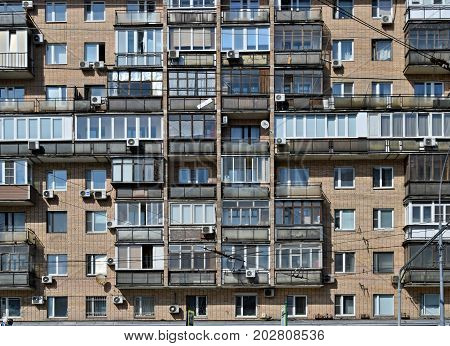 Old exterior wall of apartment building in Moscow, Russia with balconies