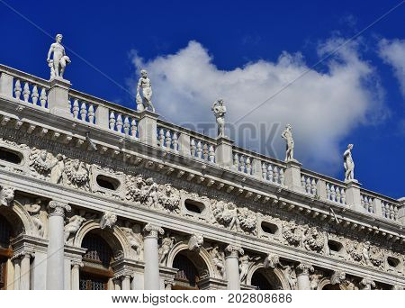 Monumental balustrade with statues of Saint Mark Library in Venice designed by the famous renaissance architect Sansovino in the 16th century