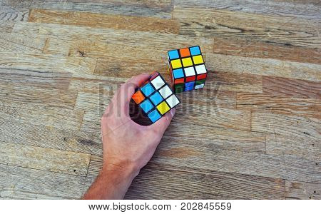 rubik cube toy with hand close up photo