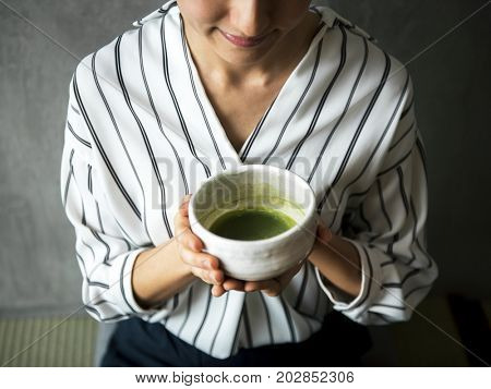 Woman making oriental green tea japanese ceremony