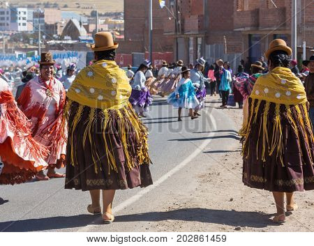 PUNO, PERU - AUGUST 07: Authentic Colorful Carnival on the streets of Puno, Peru near the high altutude Titicaca lake on August 7th, 2017
