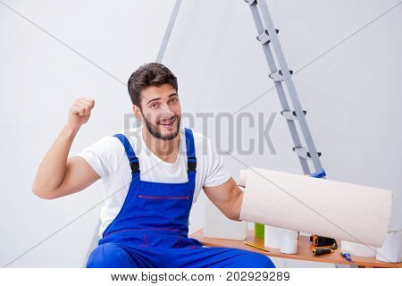 Repairman doing renovation repair in the house with paper wallpa