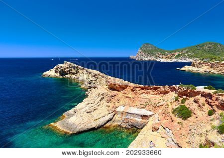 Picturesque beach of Punta Galera is an amazing bay surrounded by stone formations. Balearic Islands. Spain