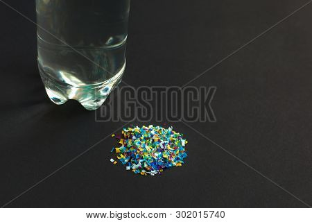 Microplastic Contaminated Water In The Bottle. A Pile Of Microplastic That Is Taken Out Of The Water