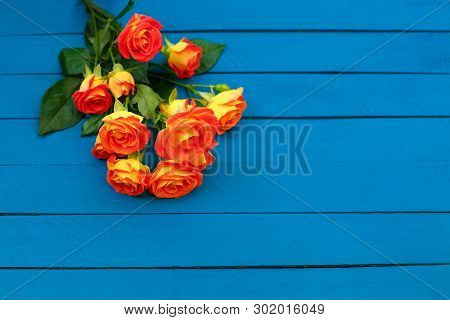 Background Of A Bouquet Of Beautiful Fresh Vivid Orange Roses For Celebrating An Anniversary, Birthd