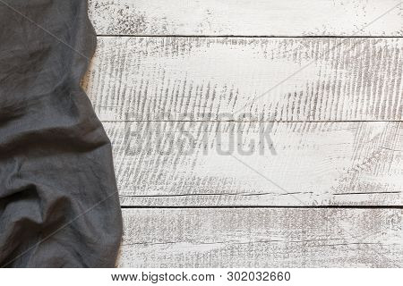 Rustic Gray Linen Napkin On Wooden Board With Copy Space. Top View.
