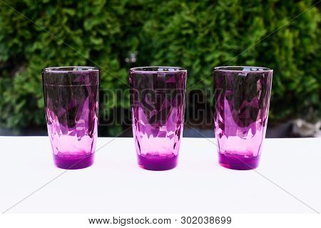 3 Tons Of Glasses In Nature, Summer Dishes, Colorful Dishes, Copy Space.