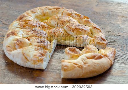 Slices Of Ramadan Pita (ramazan Pidesi) Traditional Turkish Bread For Holy Month Ramadan On Wooden B