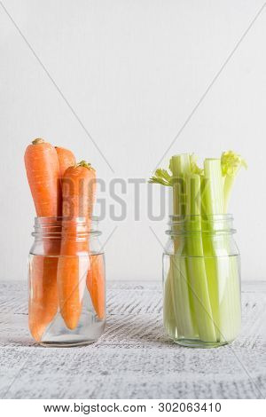 Fresh Carrot And Celery In Mason Jar With Water. Save Summer Harvest. Storage. Zero Waste.