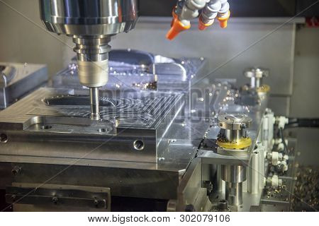The  Operation Of Cnc Machining Centre Cutting The Mould Parts .the Cnc Milling Machine Rough Cuttin