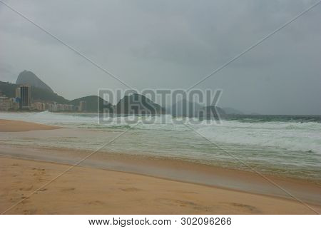 Rio De Janeiro: The Most Famous Beach, Copacabana Beach In Cloudy Weather. Brazil