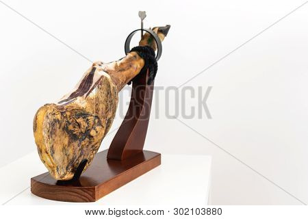 Spanish Delicatessen Dry Cured Meat Ham, Whole Leg, Jamon Iberico Bellota On Jamonero Stand Selectiv