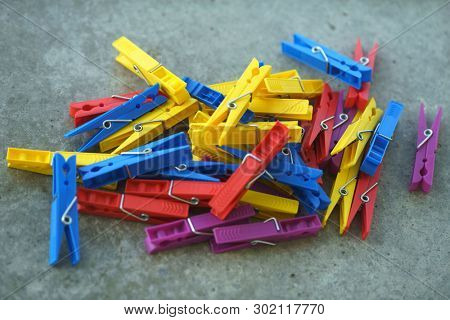Colorful Plastic Clothespins, Clothes Pegs, Clothespins Collection, Background and Texture of Scattered Clothespins, Lots of Clothespins