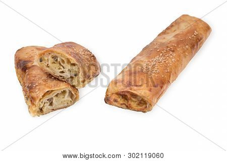 Baking Puff Pastry With Potatoes And Mushrooms, One Pastry In The Cut. Isolated On White Background