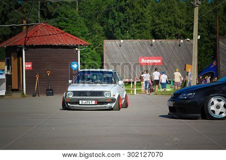 Moscow. Russia - May 20, 2019: White Tuned In Stance Style Volkswagen Golf Mk 1. Low Car With Wide R