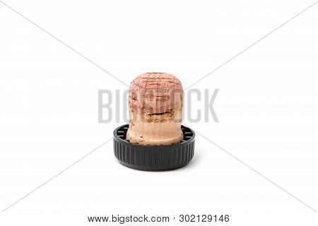 Cork For Wine With A Black Plastic Hat. Isolated On White Background.
