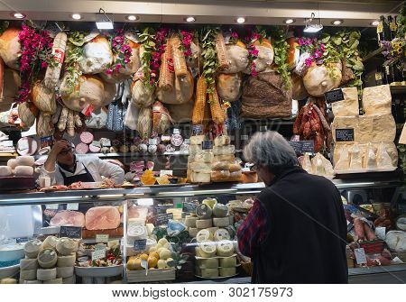 Florence/italy- April 6, 2018: Man Looking At Display With Various Italian Gourmet Meat And Cheese P