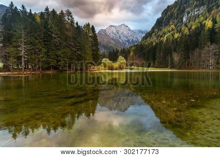 View Of Mount Skuta. Plansar Lake Or Plansarsko Jezero On Valley Zgornje Jezersko In Autumn. Norther