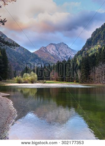 View Of Mount Skuta. Plansar Lake Or Plansarsko Jezero On Valley Zgornje Jezersko In Autumn. Norther
