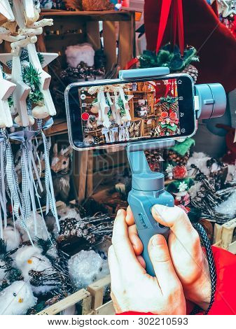 Germany, Nuremberg - December 17, 2018: Close-up Of Man Blogger Hands Shooting Video On Smartphone I