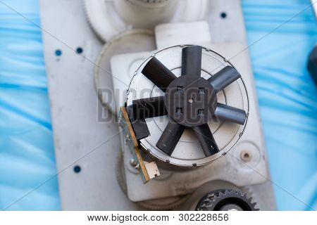 Part Of Laser Printer. Block With Electric Motor. Closeup View On The Impeller Which Is On The Top O