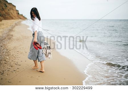 Happy Boho Woman Relaxing At Sea, Enjoying Walk On Tropical Island. Stylish Hipster Girl Walking Bar