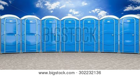 3d Illustration Of A Group Of Mobile Blue Bio Toilets.