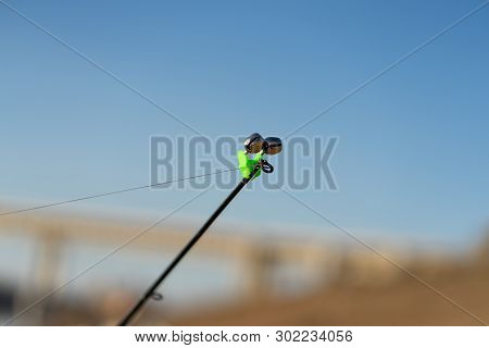 Fishing Bell At The End Of A Fishing Rod. Bells Will Ring When The Fish Is Hooked. The Tip Of The Fi