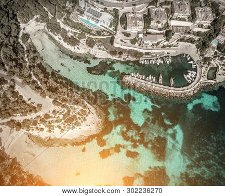 Beautiful birdeye view on the sea coastline with pier and yakhts at sunny day. Travell, jorney,islands, Seascape, freedom, holidays concept.