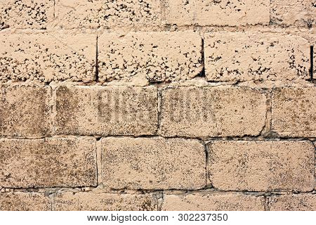 Brick Wall Fragment. Old Dirty Orange And Red Bricks With Defects. Grunge Texture With Cracks And We