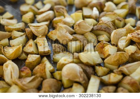 Roasted Potatoes Close Carlic Clovesin The Trey