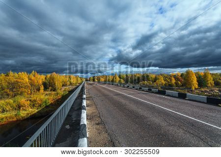 The Highway Through The Autumn Wood In Sunny Day, Mari El, Russia, 88k-002