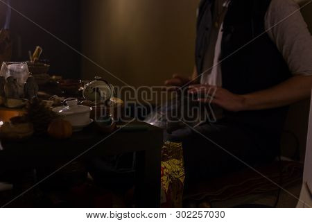 Man Playing Tank Drum Or Hang At Home. Warm Romantic Illumination, Low Key. Relaxation, Meditative A