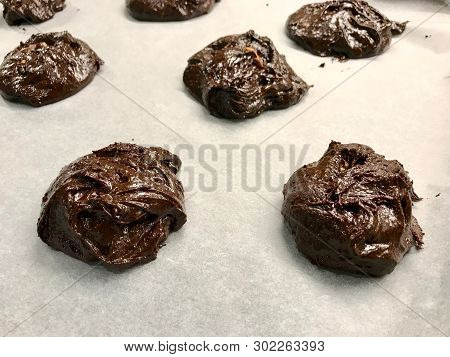 Raw Cookies On Oven Tray Ready To Cook / Chocolate Brownie With Walnut Cookie.