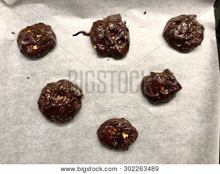Raw Cookies On Oven Tray Ready To Cook / Chocolate Brownie With Walnut Cookie.