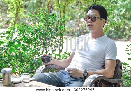 Unaware Man Or A Man Is Drinking Coffee