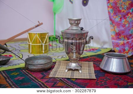 Crystal Glass Of Tea On With Metal Samovar . Cast Iron Old Pot . Iron Wok Very Old . Azerbaijan Tea 