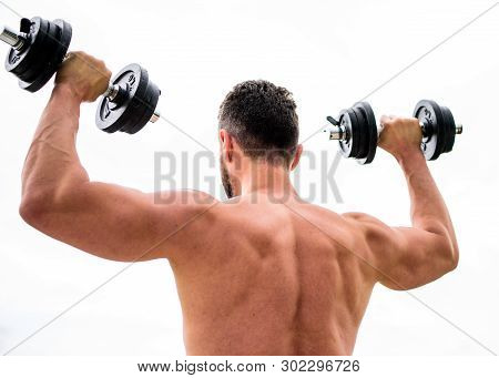 Fitness And Sport Equipment. Athletic Body. Dumbbell Gym. Man Sportsman Weightlifting. Steroids. Mus
