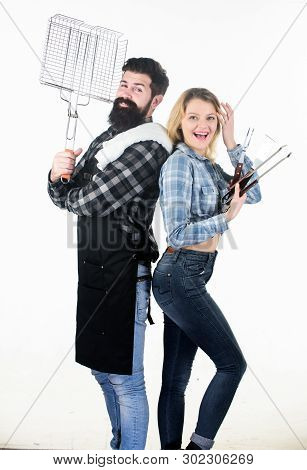 Roasting And Grilling Food. Couple In Love Hold Cooking Utensils Barbecue. Tools For Roasting Meat O