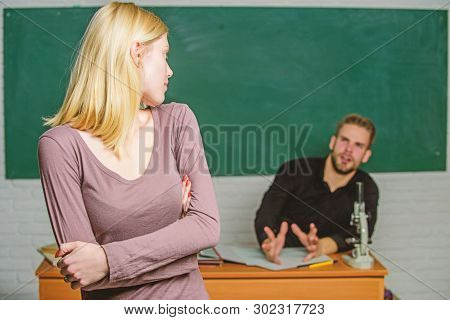At Exam Session. High School Student Answering At Seminar. Female Student With Schoolmaster At Exami
