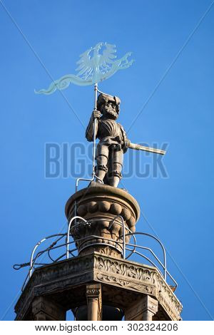 An image of a statue at the top of the Kilian Church in Heilbronn Germany