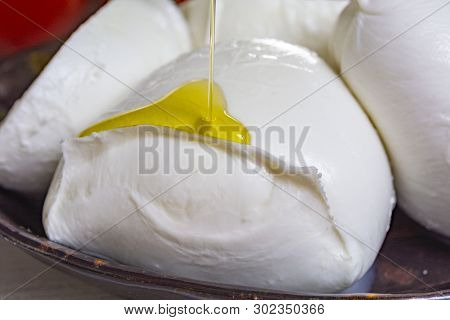 Balls And Pieces Of Buffalo Mozzarella, Soft Italian Scheese Made From The Milk Of Italian Mediterra