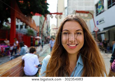 Portrait Of Beautiful Smiling Woman In Sao Paulo Japanese Neighborhood Liberdade, Sao Paulo, Brazil