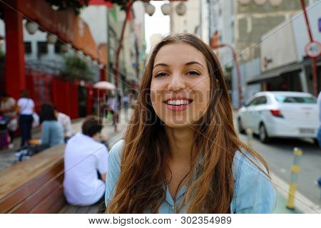 Portrait Of Beautiful Smiling Woman In Sao Paulo Japanese Neighborhood Liberdade, Sao Paulo, Brazil