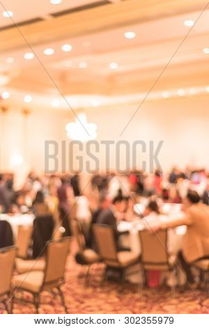 Blurry Background Diverse People At Gala Dinner In Hotel Banquet Room